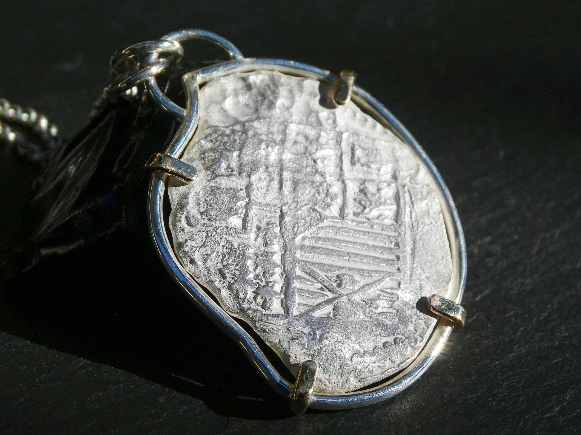 Large silver treasure coin pendant with 14k gold prongs and sterling silver setting on thick chain
