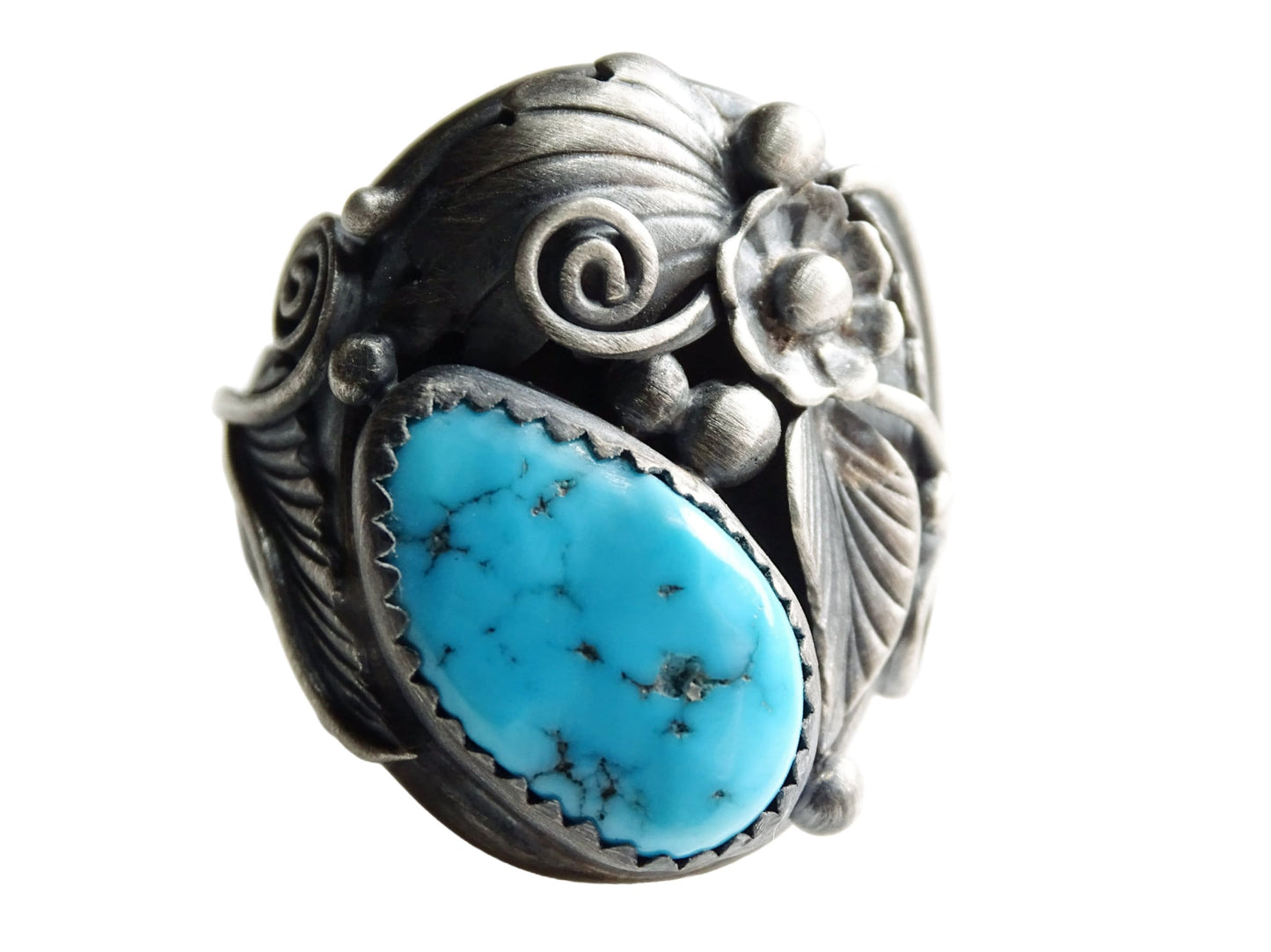 Native American turquoise ring with genuine blue turquoise stone set in detailed silver floral and leaf design, size US 9 1/2.