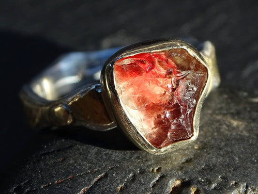 Raw Oregon sunstone ring with red and champagne crystal set in 14k gold and sterling silver band