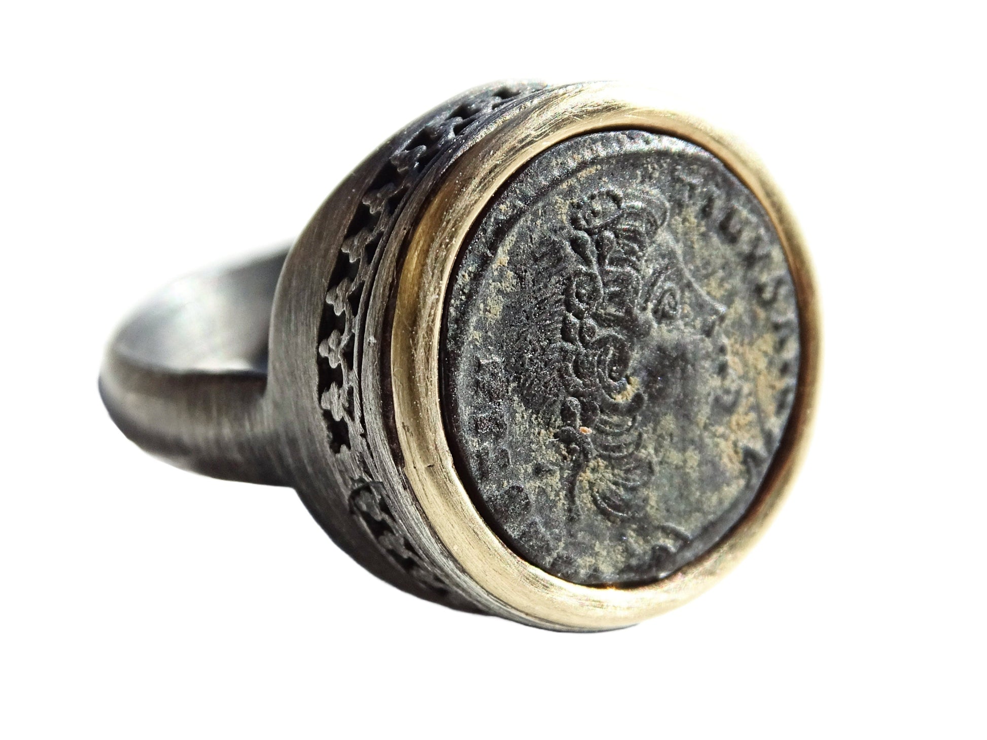 Ancient coin ring with authentic Roman bronze coin set in 14k gold bezel and black oxidized sterling silver band.