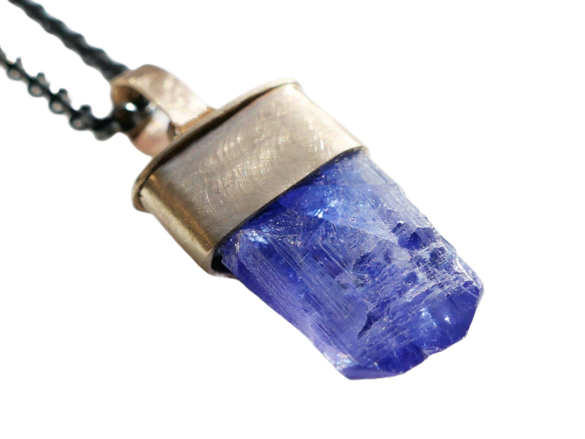 tanzanite pendant with an uncut gemstoone