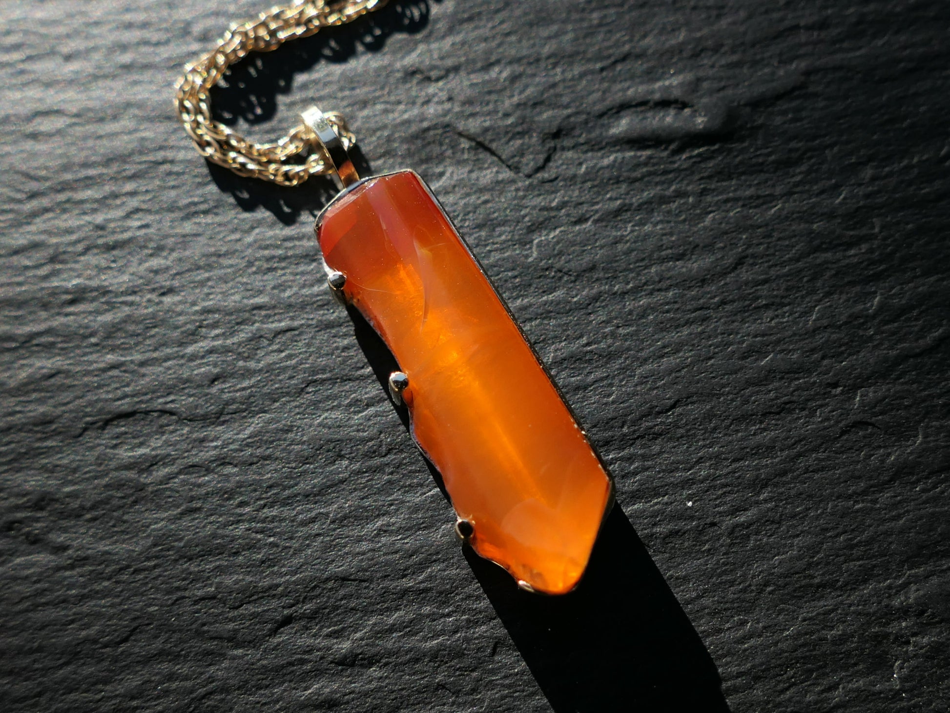 Handcrafted orange fire opal necklace with 14k gold and sterling silver pendant, 29x9mm opal.