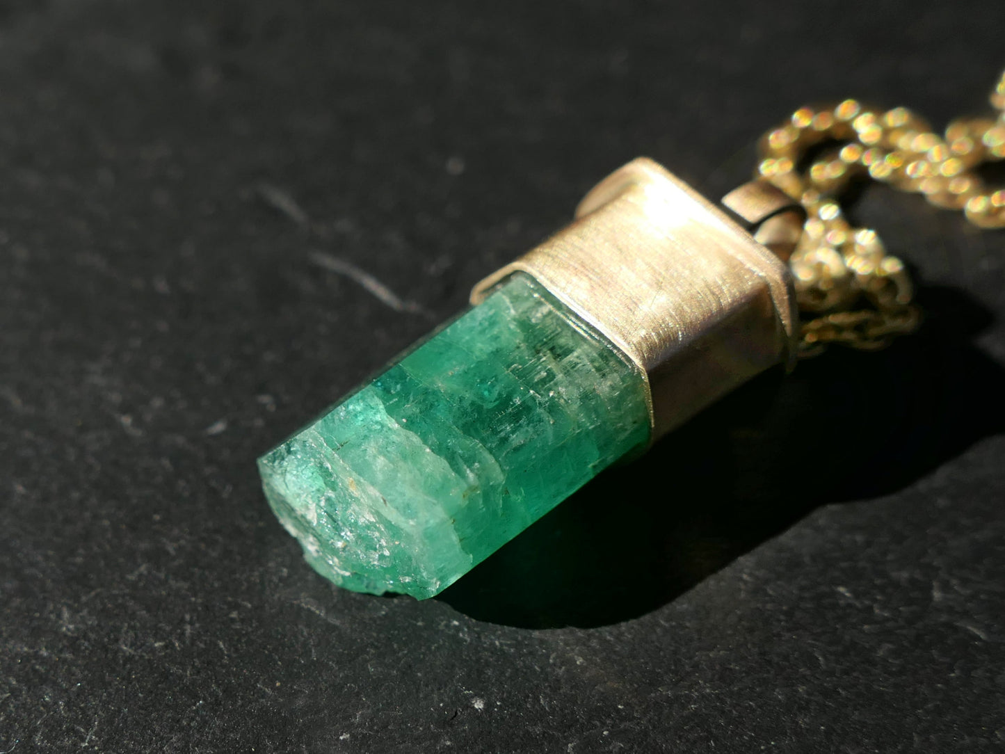 Natural Zambian Emerald crystal pendant in 14K gold necklace with six-sided untreated May birthstone