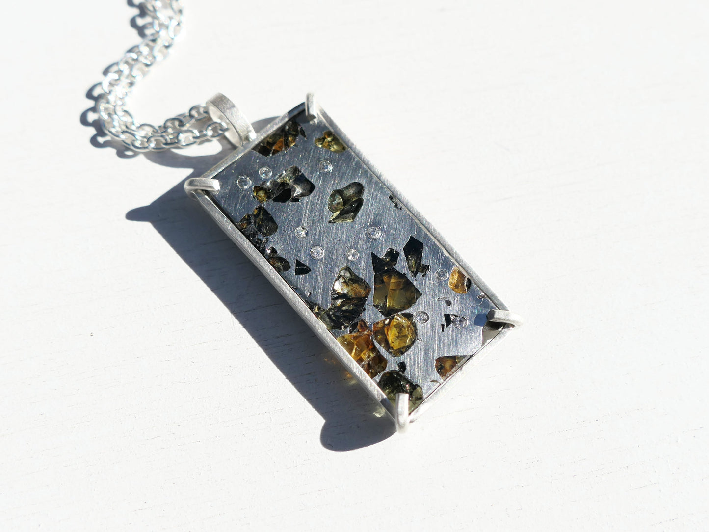 Sterling silver Pallasite meteorite pendant with diamond accents and Seymchan meteorite slice