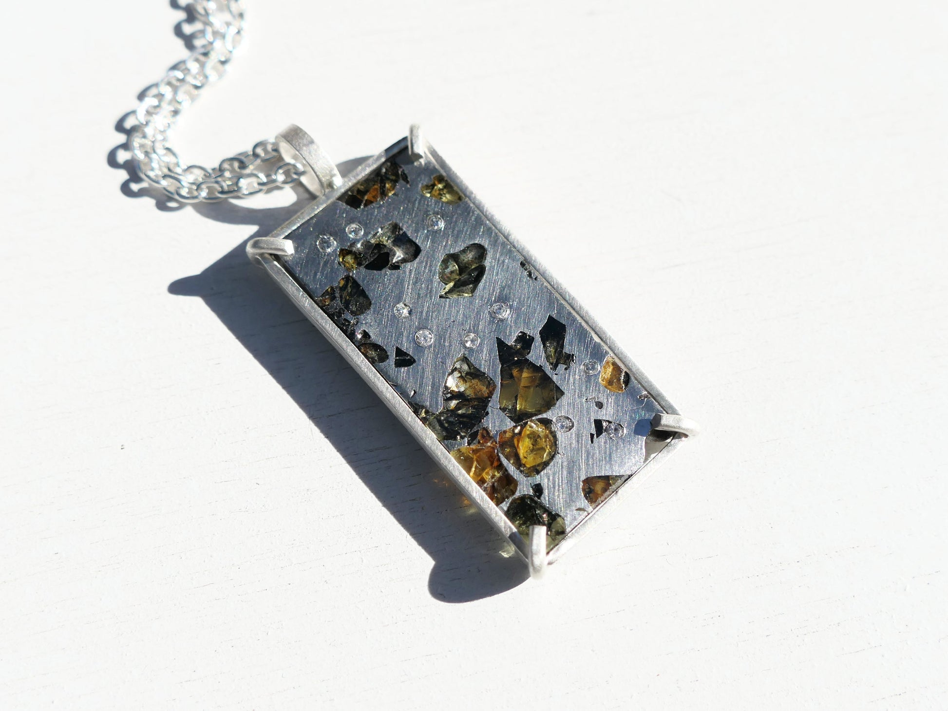 Sterling silver Pallasite meteorite pendant with diamond accents and Seymchan meteorite slice