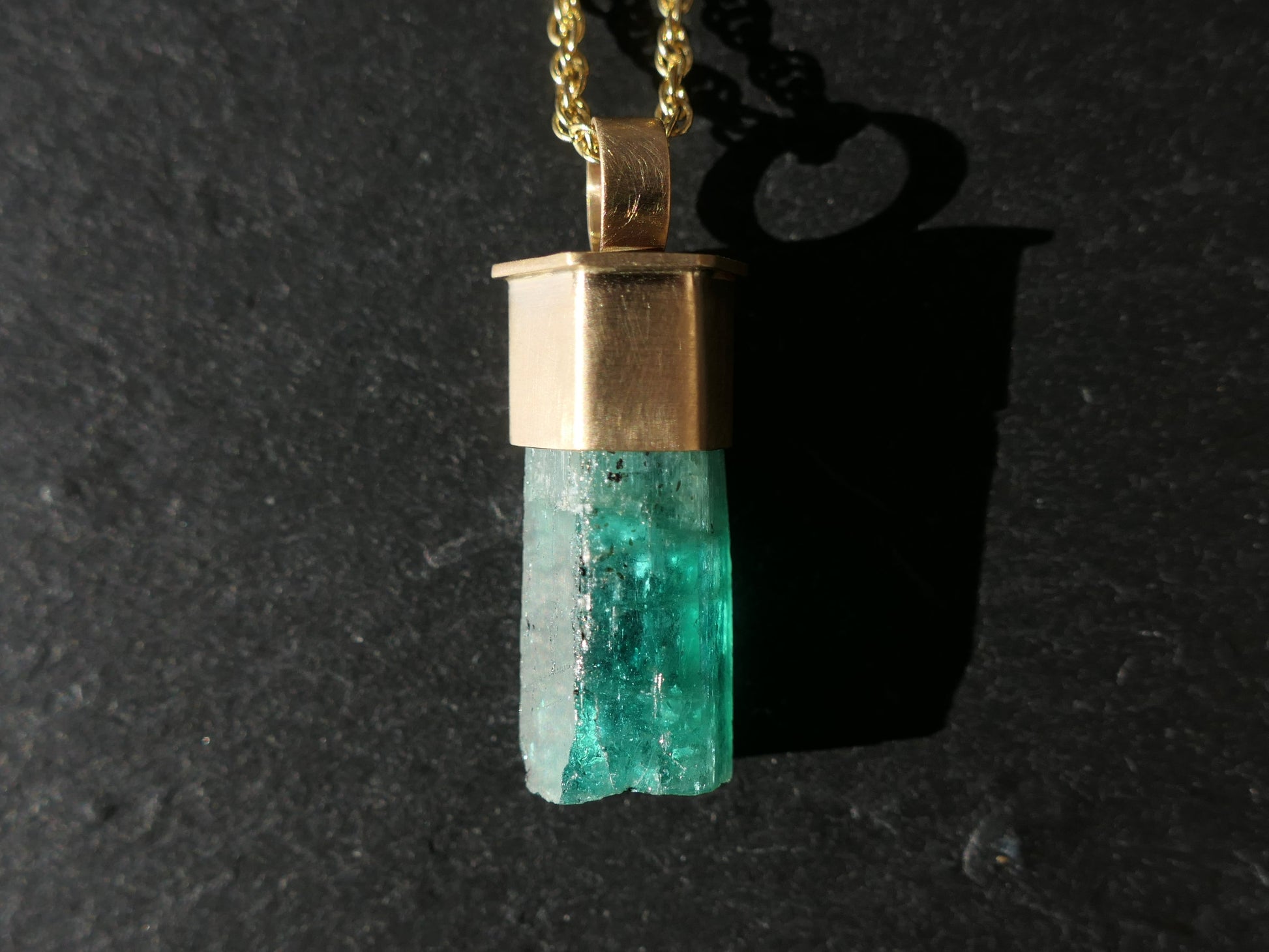 Emerald crystal set in 14K gold