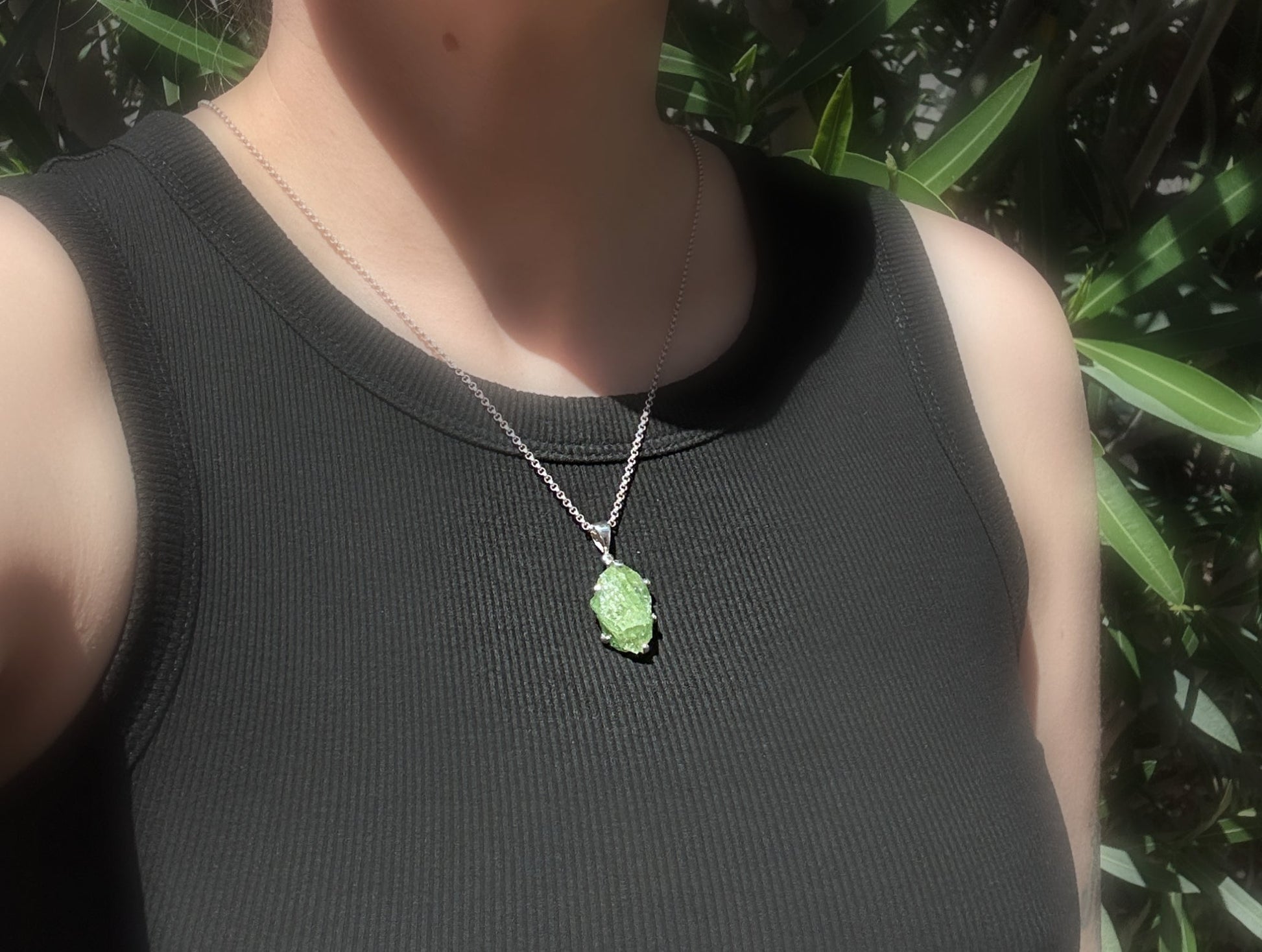Large uncut green tsavorite garnet crystal pendant set in sterling silver necklace