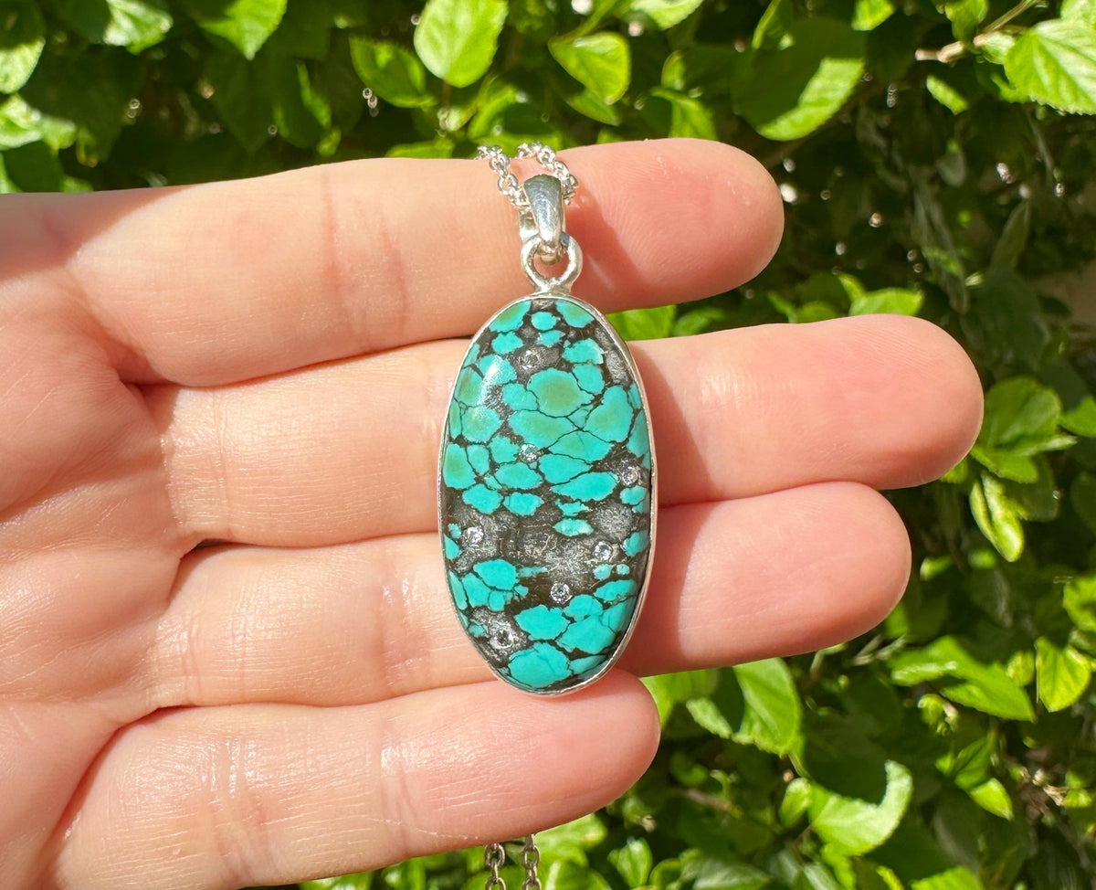 blue turquoise pendant black matrix with diamonds