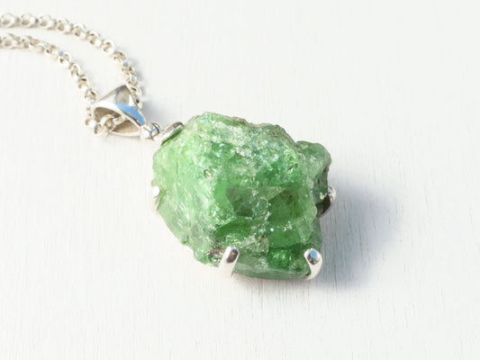 Large tsavorite crystal necklace pendant in sterling silver with uncut green garnet gemstone