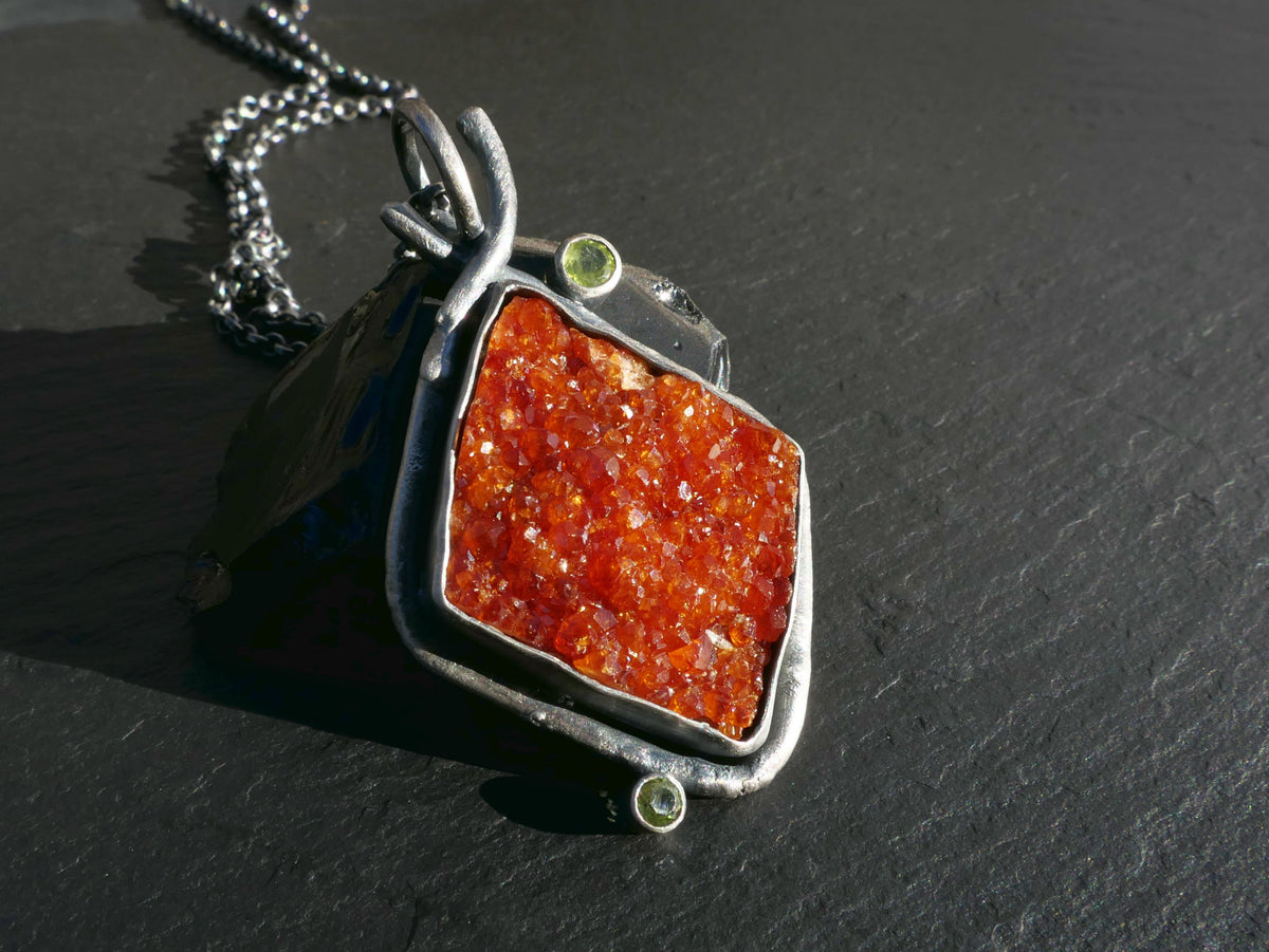 garnet crystal pendant with green peridot