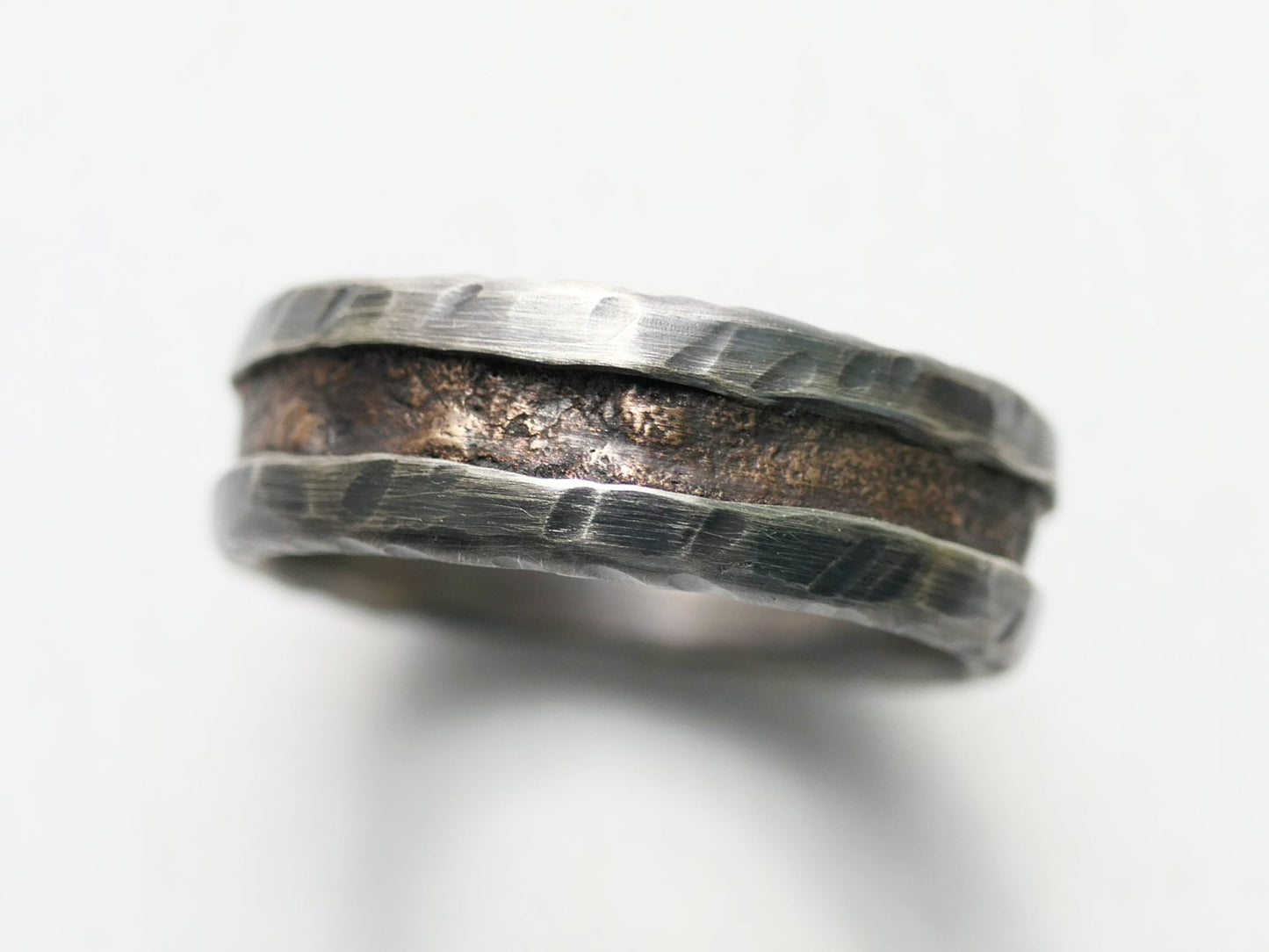 Unique men's ring with bronze and silver band, 7mm wide, dark oxidized finish, engraved interior, made to order