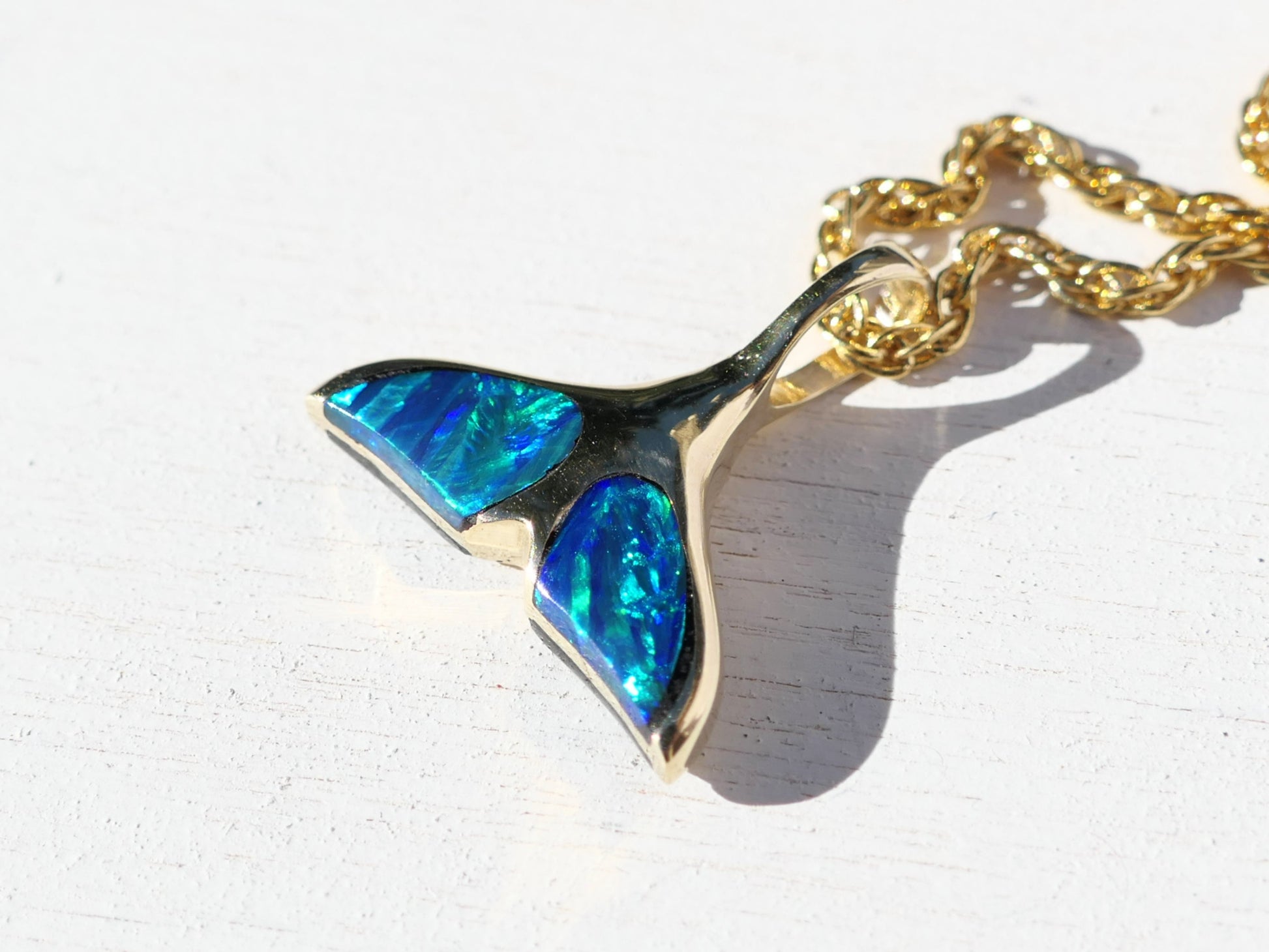 black opal and 14k gold whale tail charm necklace