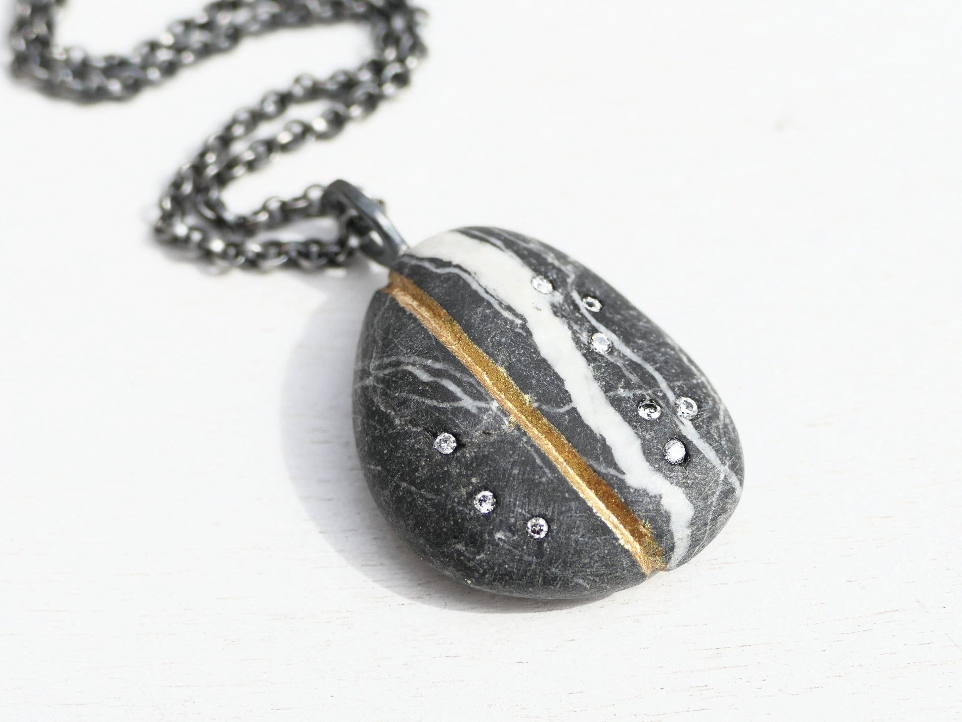 River stone pendant with diamonds