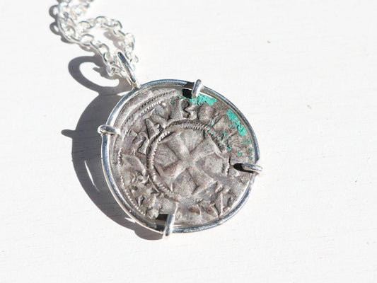 Crusader Coin Necklace with an ancient silver coin in a polished sterling silver setting, featuring worn relief and patina.