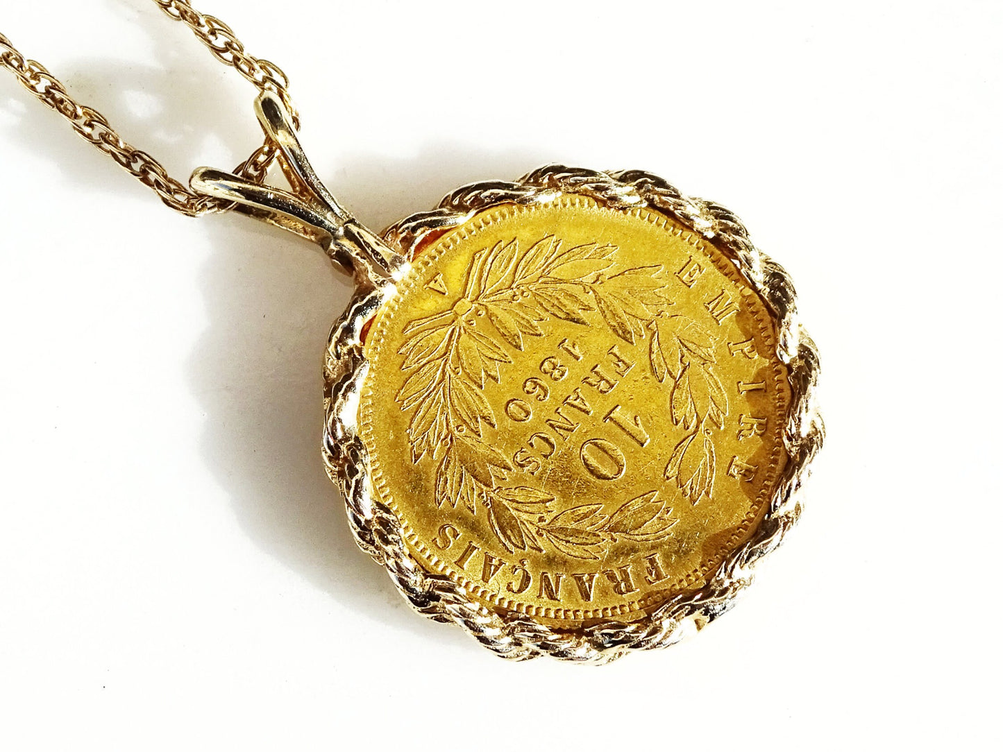 Authentic 1860 10 Francs gold coin pendant, set in solid 14k gold.Minimalist coin necklace, great for layering or also as a single piece. 
&gt; overall pendant hangi