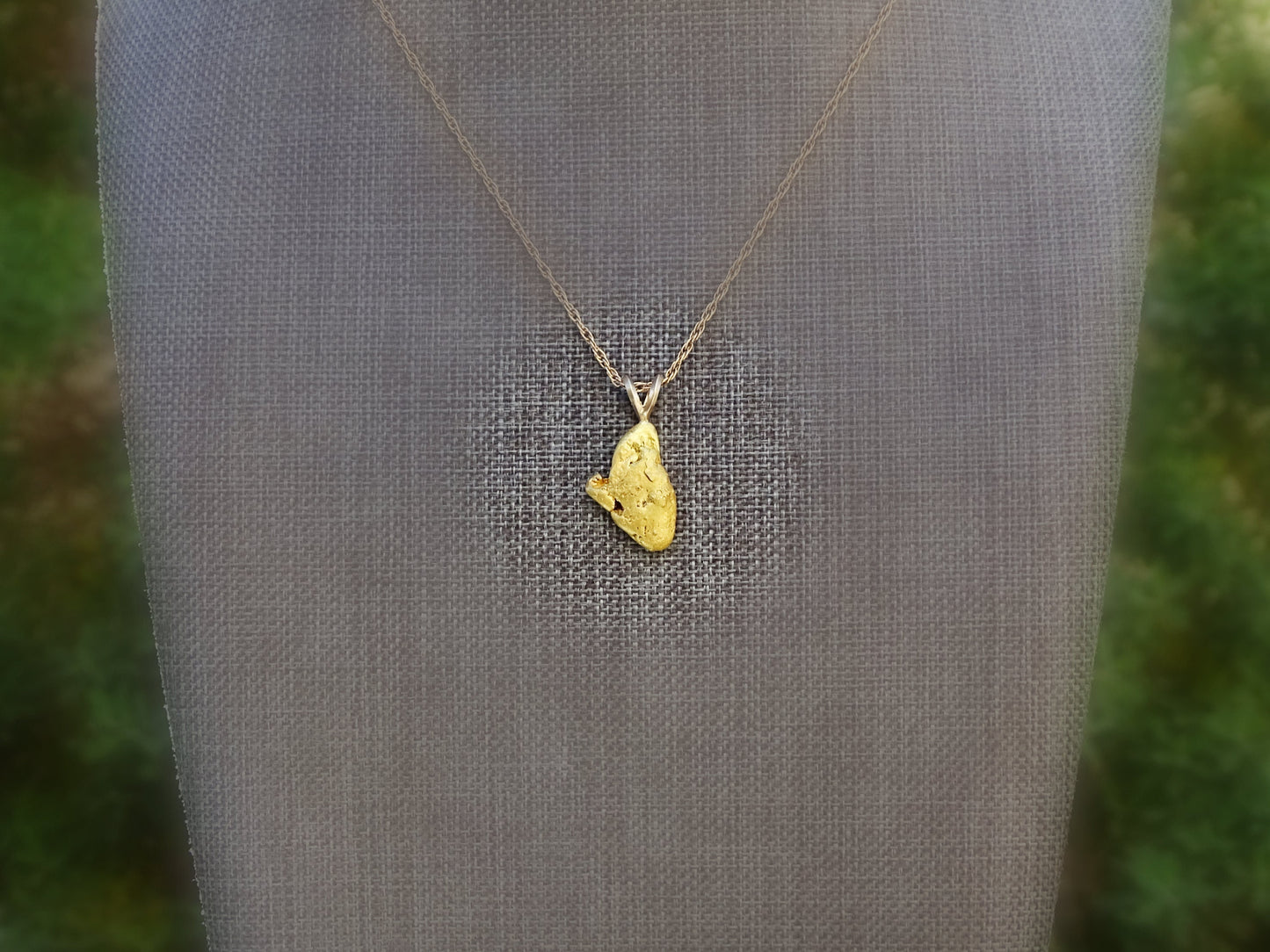 Real gold nugget pendant from Alaska.
&gt; overall pendant length is 24.5mm (0.96 inches) including the bail, weighing a total of 5.05 grams &gt; all natural gold nu