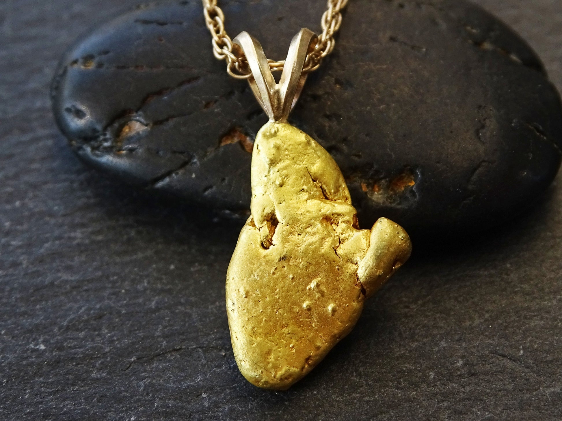 Real gold nugget pendant from Alaska.
&gt; overall pendant length is 24.5mm (0.96 inches) including the bail, weighing a total of 5.05 grams &gt; all natural gold nu