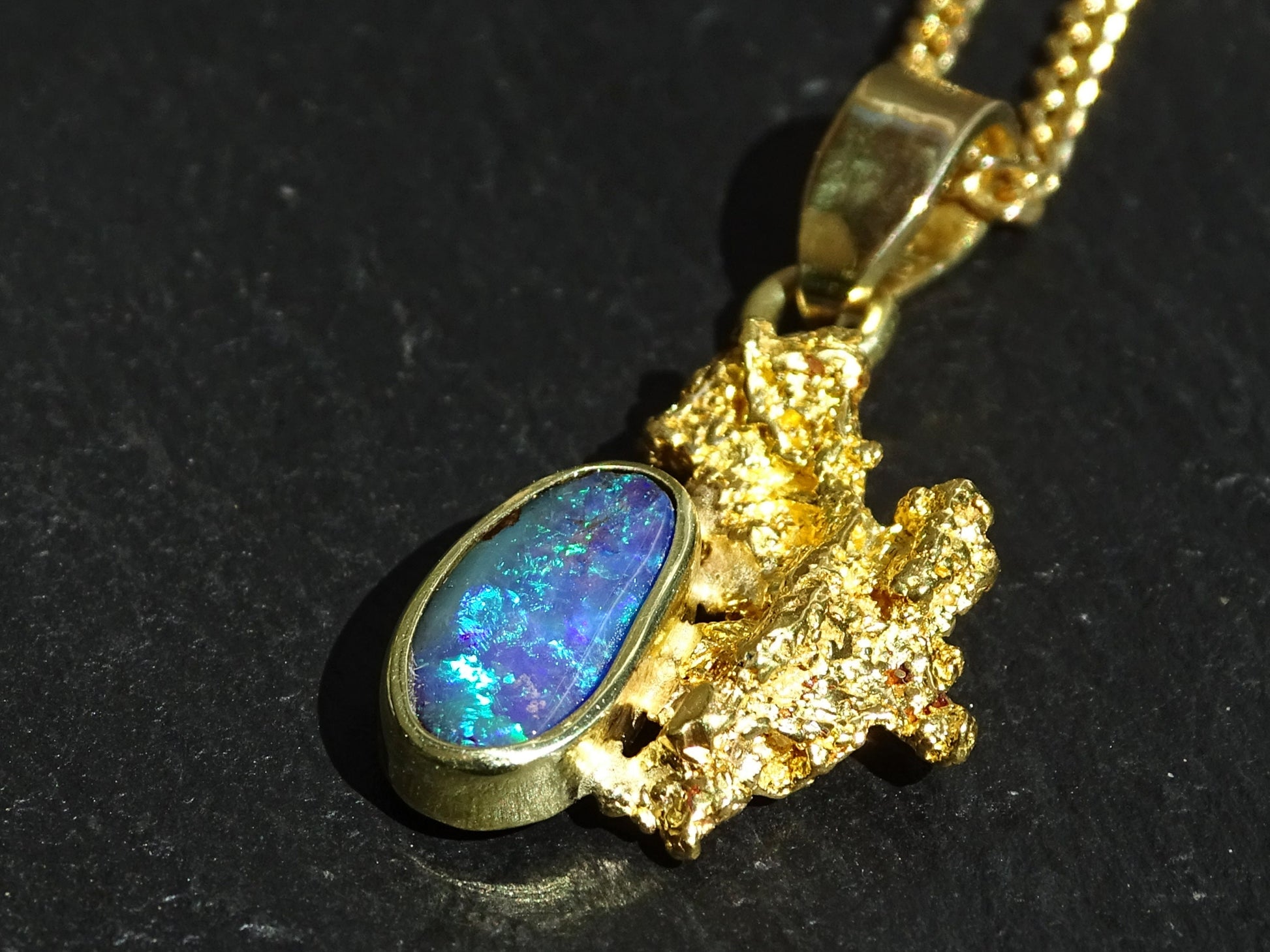 Alaska gold nugget pendant, adorned with a blue and green Australian opal gemstone. Stunning gift for all lovers of Nature's creations and the Great Outdoors, as wel