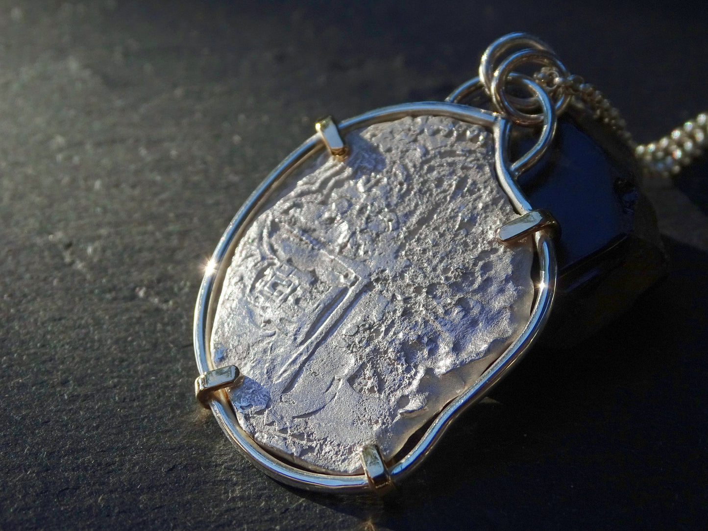 silver treasure coin set in silver and 14k gold